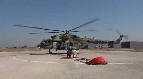 The crew of the Russian Mi-8AMTSh helicopter fights fires in Syria